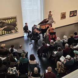 Shortly after the Museum opened in the current building, it was discovered that the expansive galleries were glorious for chamber music. Subsequently, the Museum Concert Series was born, and musicians from around the world were invited to perform against the backdrop of contemporary art. This Sunday afternoon tradition has continued for over thirty years and with the support of the community will thrive for generations to come.