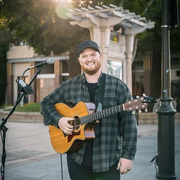 Wine Down Friday – Music by Chris Rogers, Wine Specials & Fratelli’s Pizza