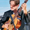 In Concert on Downtown’s Transit Mall – Johnny Franco and His Real Brother Dom at Less and More Coffee