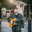 Wine Down Friday – Music by Chris Rogers, Wine Specials & Fratelli’s Pizza